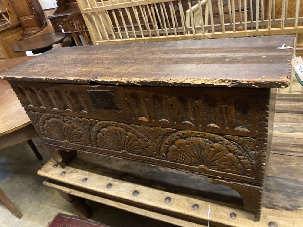 An elm and oak six plank coffer with lunette carved front, width 112cm depth 36cm height 58cm